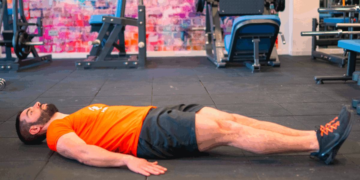 Elevação de pernas no chão Elevação de pernas no chão